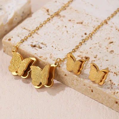 Ensemble de bijoux de collier de boucles d'oreilles en acier inoxydable de conception de papillon double pour des femmes